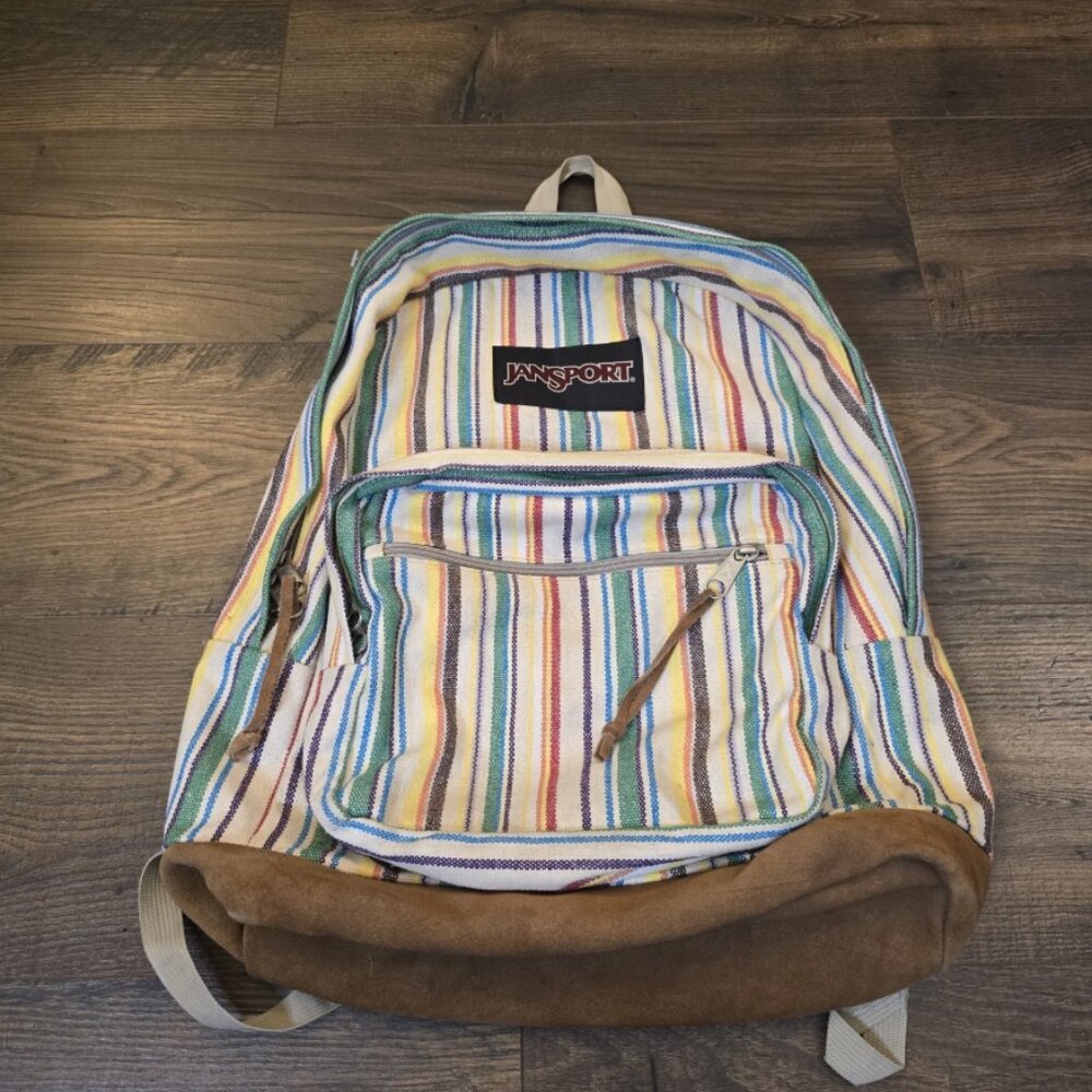 JanSport backpack with striped pattern, suitable for hiking and school.